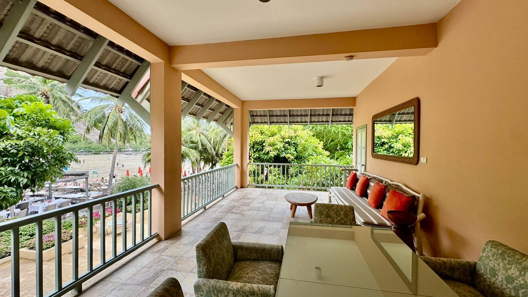 Master bedroom with two queen size beds and the second bedroom with a queen size bed and en suite bathrooms in each. Outdoor dining area and fully equipped kitchen including microwave oven. Terrace furnished with deck furniture and plants facing the sea.